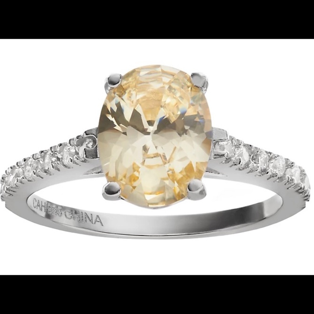 Sterling Silver, canary and white cubic zirconia. Size 5 ring.